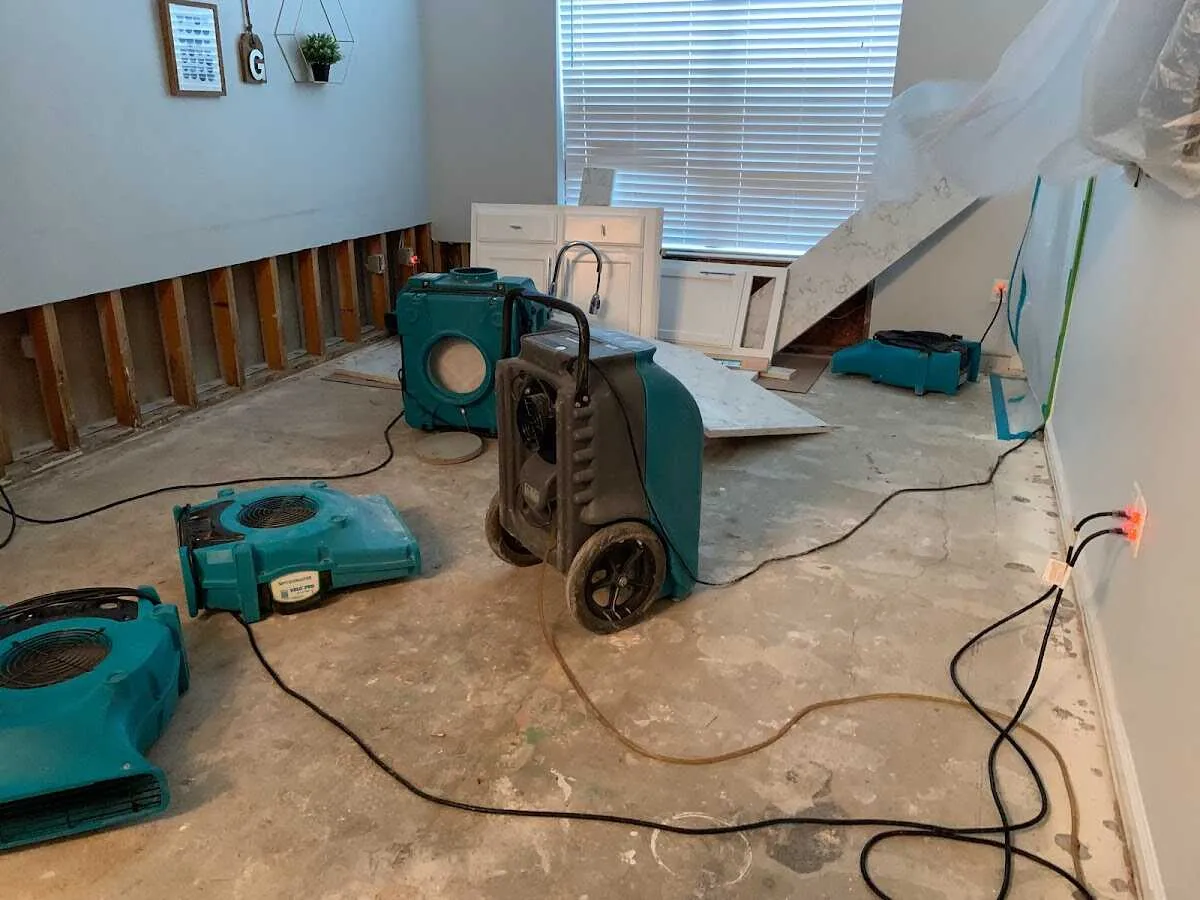 Dehumidifier in flood-cut room for Water Damage Restoration in Wells Branch